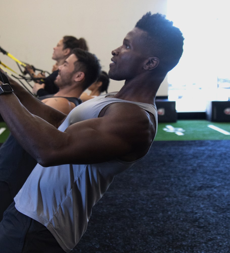 Sweat Room - Man Lifting Kettlebell